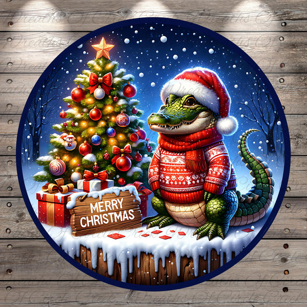 A whimsical Christmas scene featuring a crocodile wearing a Santa hat and scarf, sitting next to a decorated Christmas tree with ornaments and a star. The scene is set against a snowy background, and there is a "Merry Christmas" sign in the foreground.