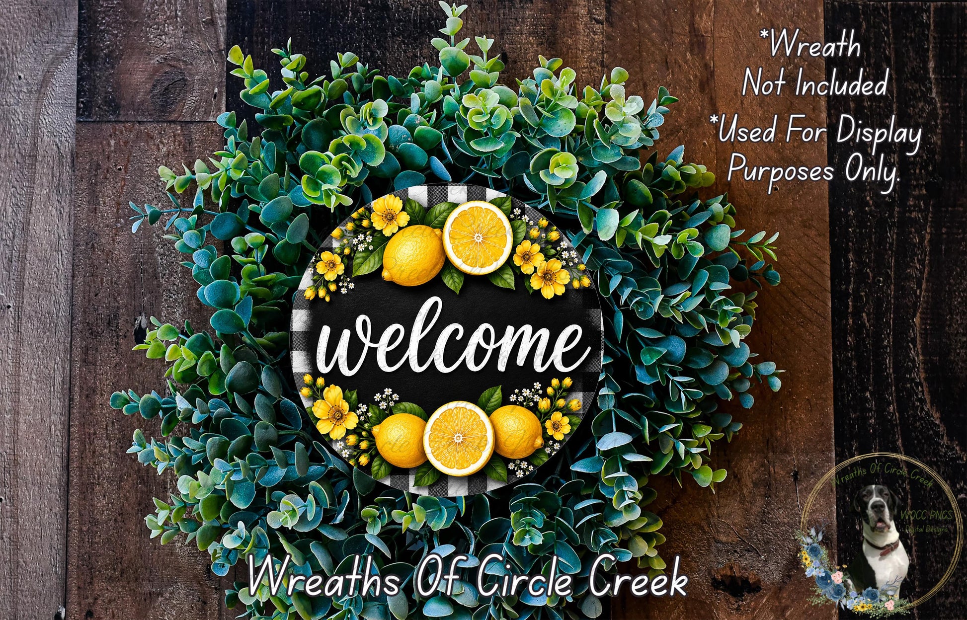a wreath made of various green and yellow plants, including eucalyptus and lemon branches, with a sign that says "Welcome" in the center.