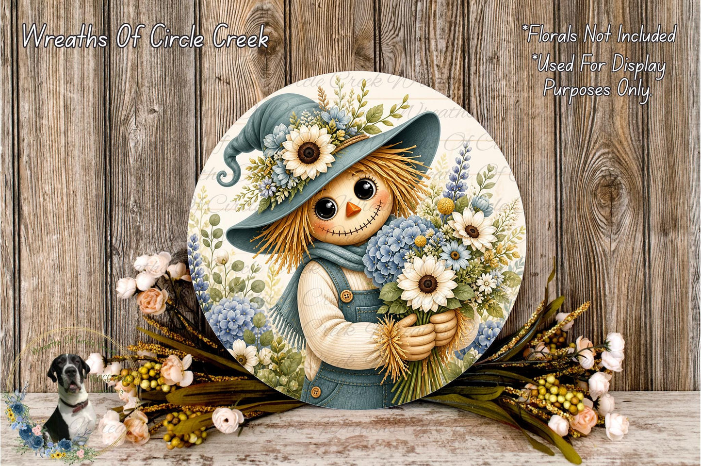A round wooden plaque featuring a scarecrow holding a bouquet of flowers, with a wooden background and additional floral decorations.