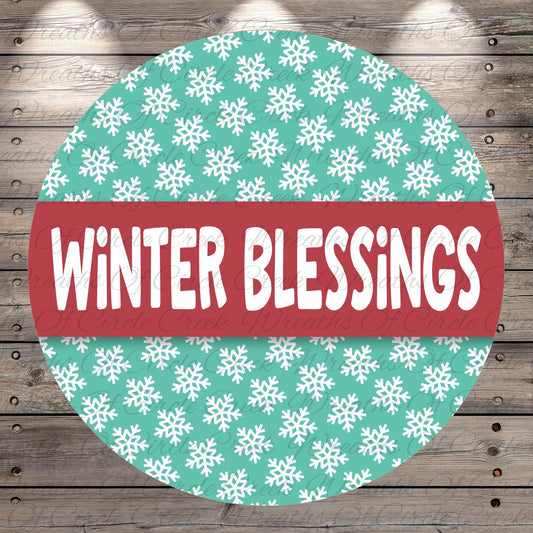 A circular sign with a pattern of white snowflakes on a teal background, and the text "Winter Blessings" written in white on a red background.