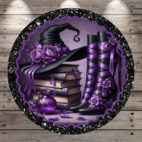 A witch's hat adorned with purple flowers, a stack of books, and purple boots with flower embellishments, all set against a purple and black background with a glittery border.
