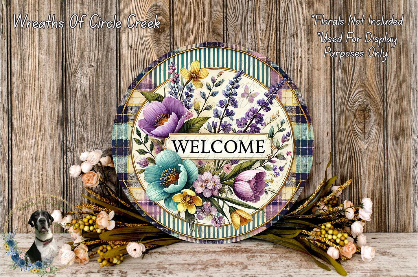 a decorative welcome sign with a floral design, surrounded by a wreath of flowers and greenery. The sign has the word "WELCOME" written on it, and the background is a wooden wall.
