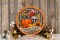A decorative wreath with a football, pumpkin, sunflower, and other fall-themed items, along with a banner that says "Pumpkin Season". The wreath is set against a rustic wooden background, and there are some flowers and greenery surrounding it.