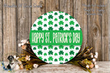 a circular sign with the text "Happy St. Patrick's Day" displayed on it, surrounded by a wreath of flowers and greenery.