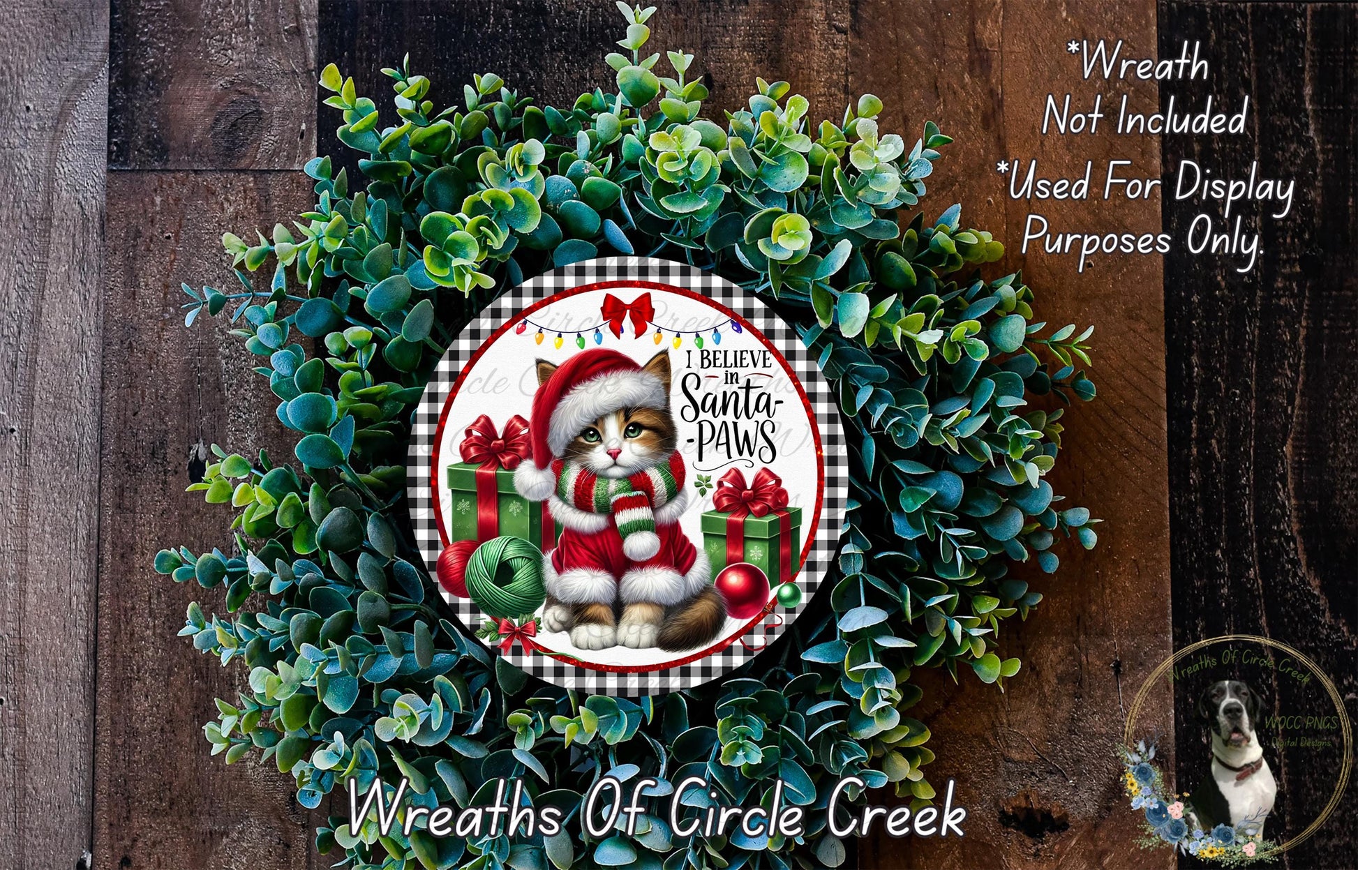 A wreath made of green leaves and a Santa Claus figurine, with the text "I Believe Santa Paws" and "Wreaths of Circle Creek" displayed on it.