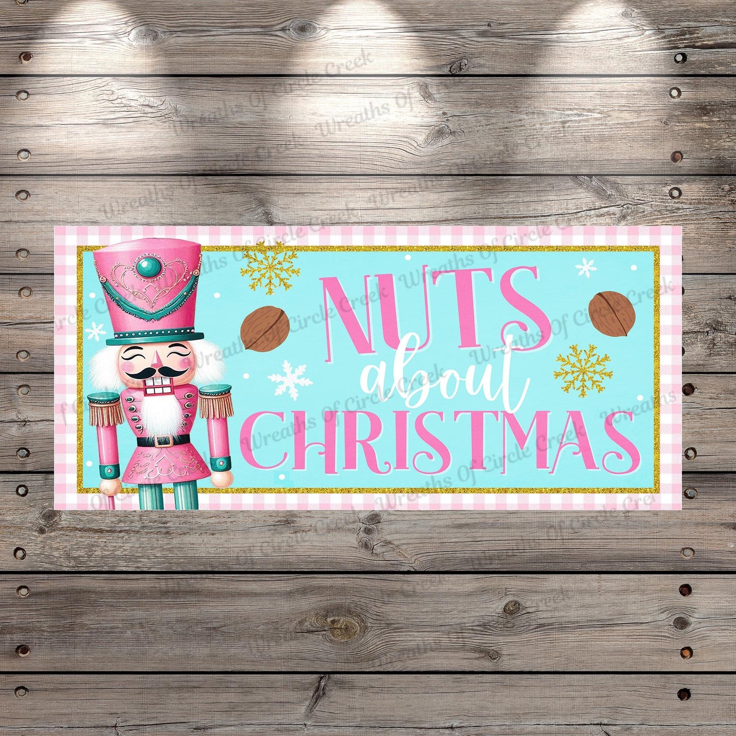 a wooden wall with a sign that says nuts about christmas