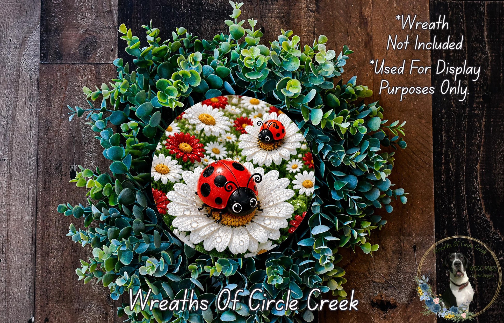 A wreath made of various green plants and white flowers, including daisies and a ladybug, with a wooden background.