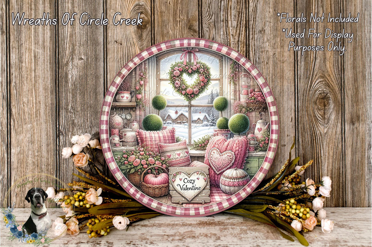 a decorative plate with a floral arrangement and a heart-shaped wreath, placed on a wooden surface. The plate is surrounded by various flowers and greenery, creating a charming and festive atmosphere.