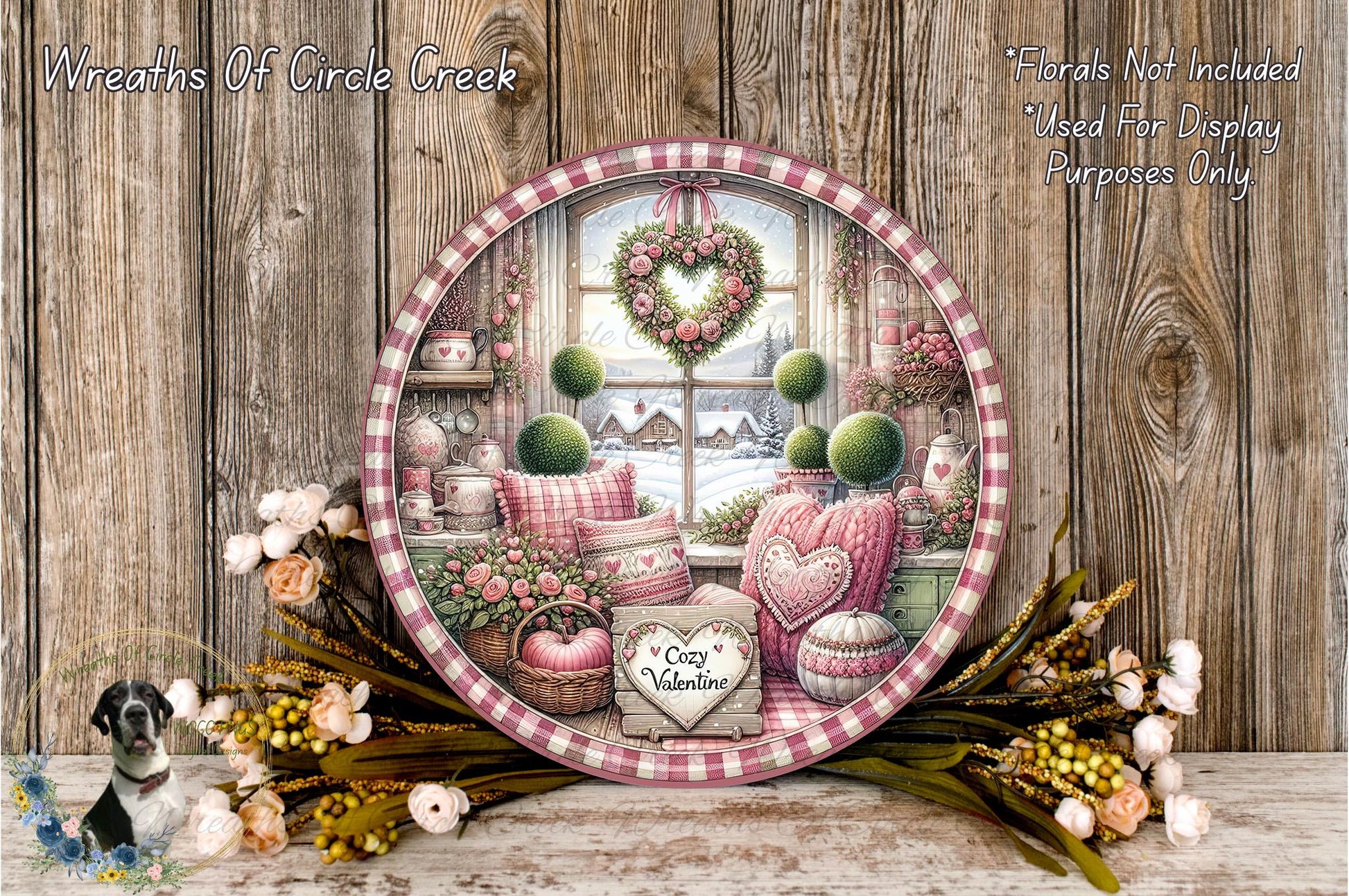 a decorative plate with a floral arrangement and a heart-shaped wreath, placed on a wooden surface. The plate is surrounded by various flowers and greenery, creating a charming and festive atmosphere.