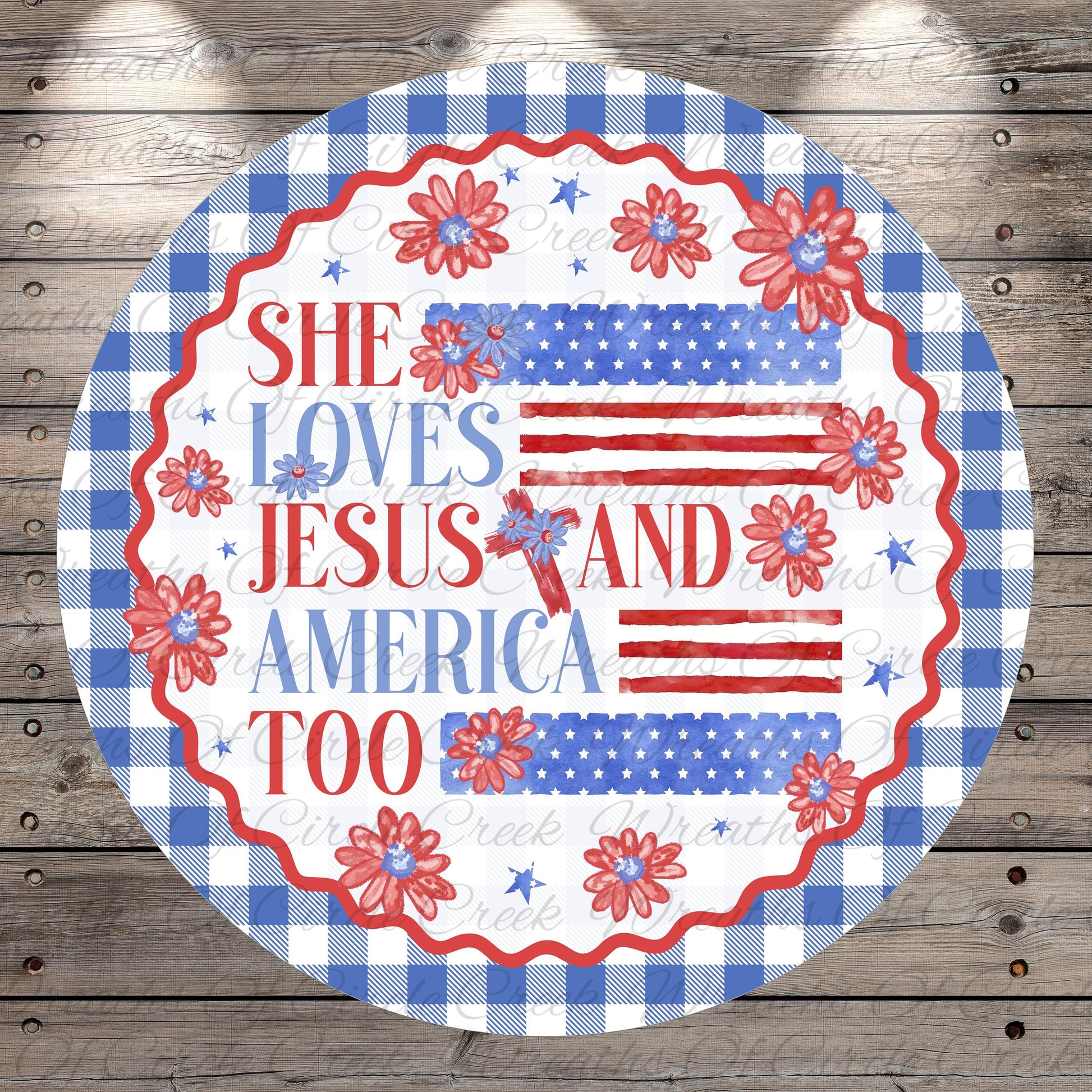 A circular design with a patriotic theme, featuring a red, white, and blue color scheme with floral and star motifs. The text on the design reads "She loves Jesus and America too".