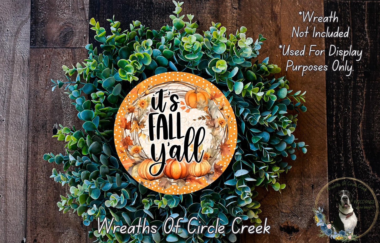 The image is a wreath made of various green plants and orange pumpkins, with a circular sign that says "It's Fall Yall" in the center.