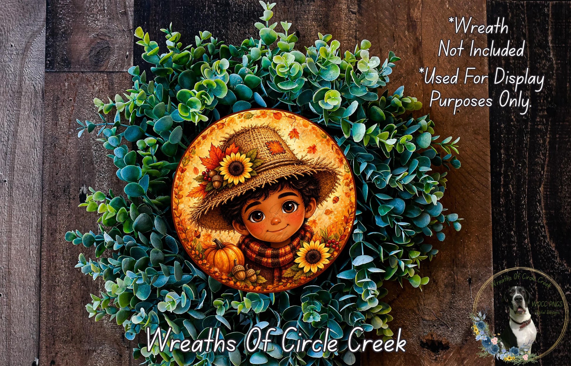 A wreath made of green plants and featuring a cartoon character wearing a straw hat and holding a pumpkin.