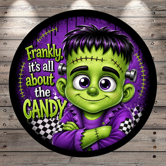 A round sticker featuring a cartoonish green monster with purple hair and a purple outfit, with the text "Frankly, it's all about the candy" written around the edges.