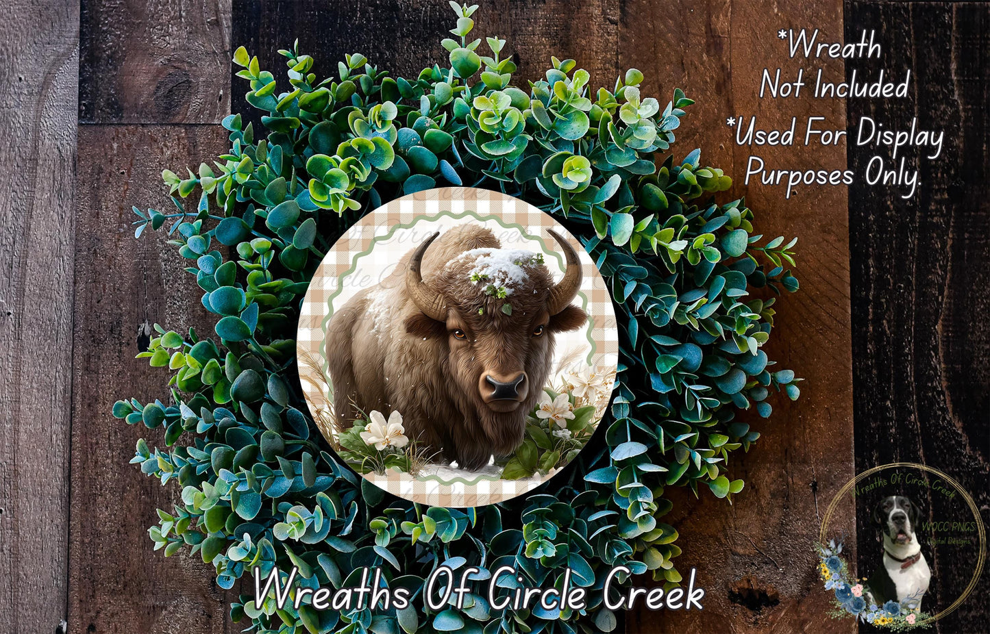 A wreath made of green foliage and flowers, with a large image of a bison or buffalo in the center.