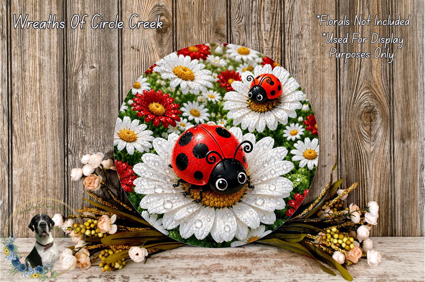 A decorative wreath featuring a ladybug and white daisies, placed on a wooden surface.