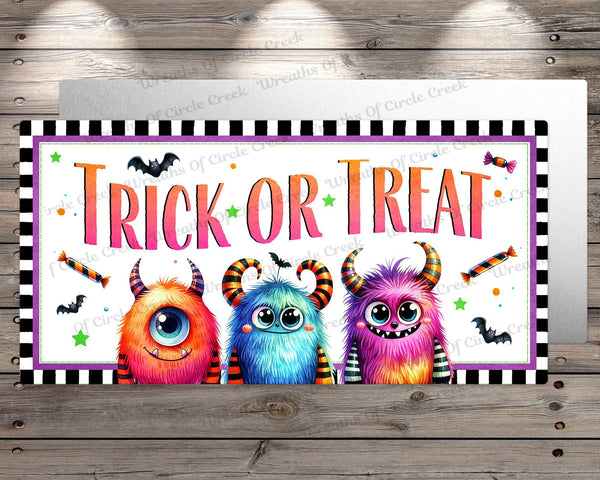 a trick or treat sign on a wooden wall