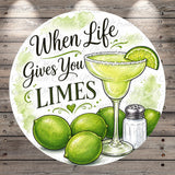 a round graphic with a margarita glass, a lime, and a salt shaker, along with the text "When Life Gives You Limes" written on it.