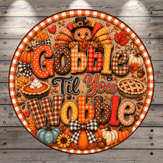 A circular decorative sign with a Thanksgiving theme, featuring a turkey, pies, pumpkins, and other fall-themed elements. The sign has the text "Gobble Till You Wobble" written on it, which appears to be a humorous and festive message related to the holiday season.
