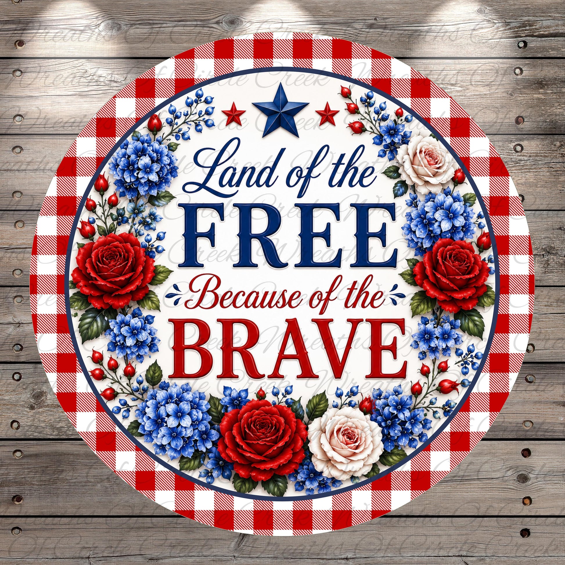 a patriotic design with a red, white, and blue border, surrounded by red, white, and blue flowers. The text "Land of the FREE Because of the BRAVE" is prominently displayed in the center of the design.