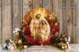 A decorative wreath featuring the Holy Family of Jesus, Mary, and Joseph, surrounded by red and gold flowers, placed on a wooden surface.