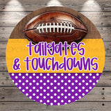 A football is displayed on a wooden surface, with the text "tailgates & touchdowns" written in a playful, colorful font.
