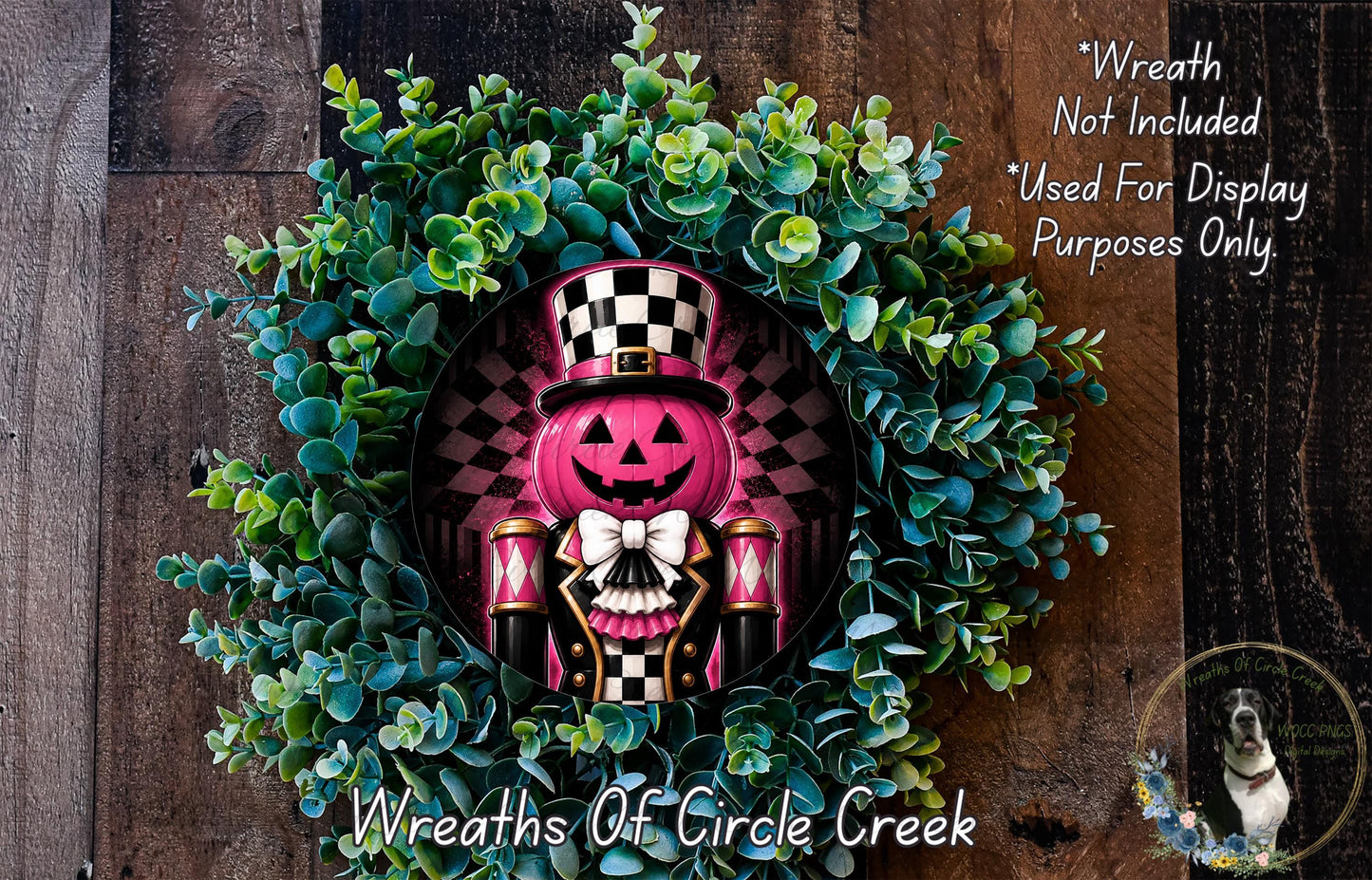 A wreath featuring a pumpkin with a black and white checkered hat, surrounded by green foliage.
