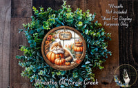 a wreath with a cat and pumpkins, surrounded by greenery, and a sign that says "Welcome Fall". The wreath is displayed on a wooden surface, and there is a text overlay that reads "Welcome Fall" and "Not included used for display purposes only".