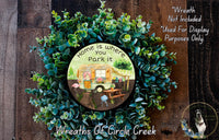 a wreath with a picture of a camper on it