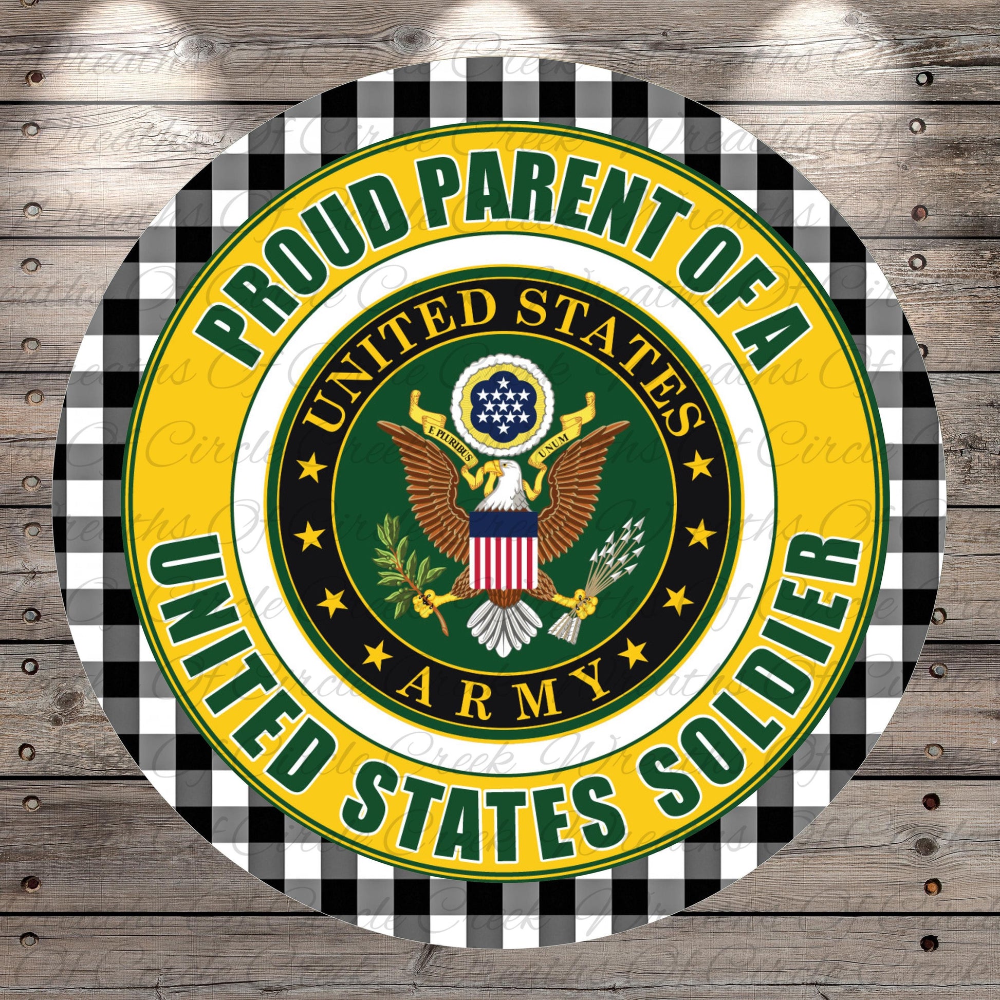 A circular emblem with the text "Proud Parent of a UNITED STATES ARMY Soldier" and the United States Army seal, surrounded by a black and white checkered border.