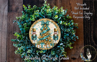 a wreath with a christmas tree on it