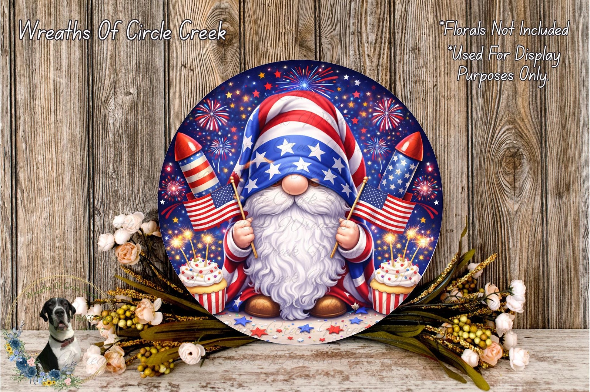 A round, decorative plate featuring a gnome holding a firework and a cake, surrounded by flowers and a wooden background.