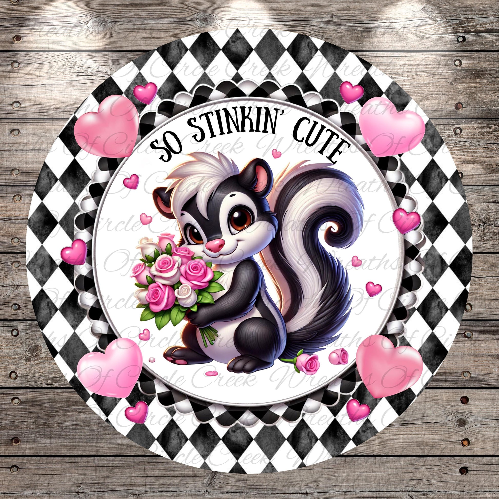 A black and white checkered frame surrounds a cartoon image of a skunk holding a bouquet of pink roses. Surrounding the skunk are pink hearts, and the text "So stinking' cute" is written above the skunk.