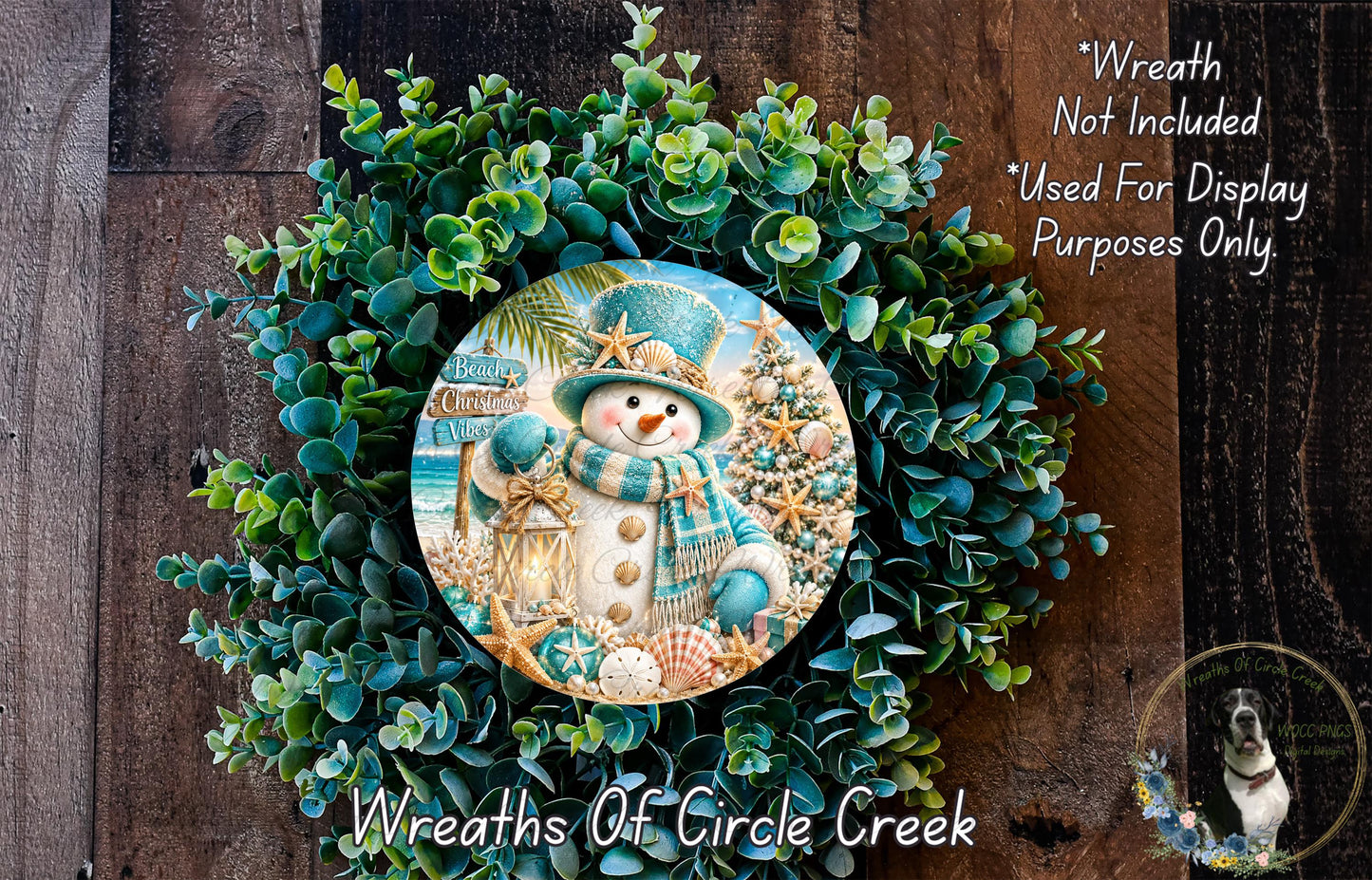 A wreath made of green foliage and featuring a snowman, palm tree, and starfish design.