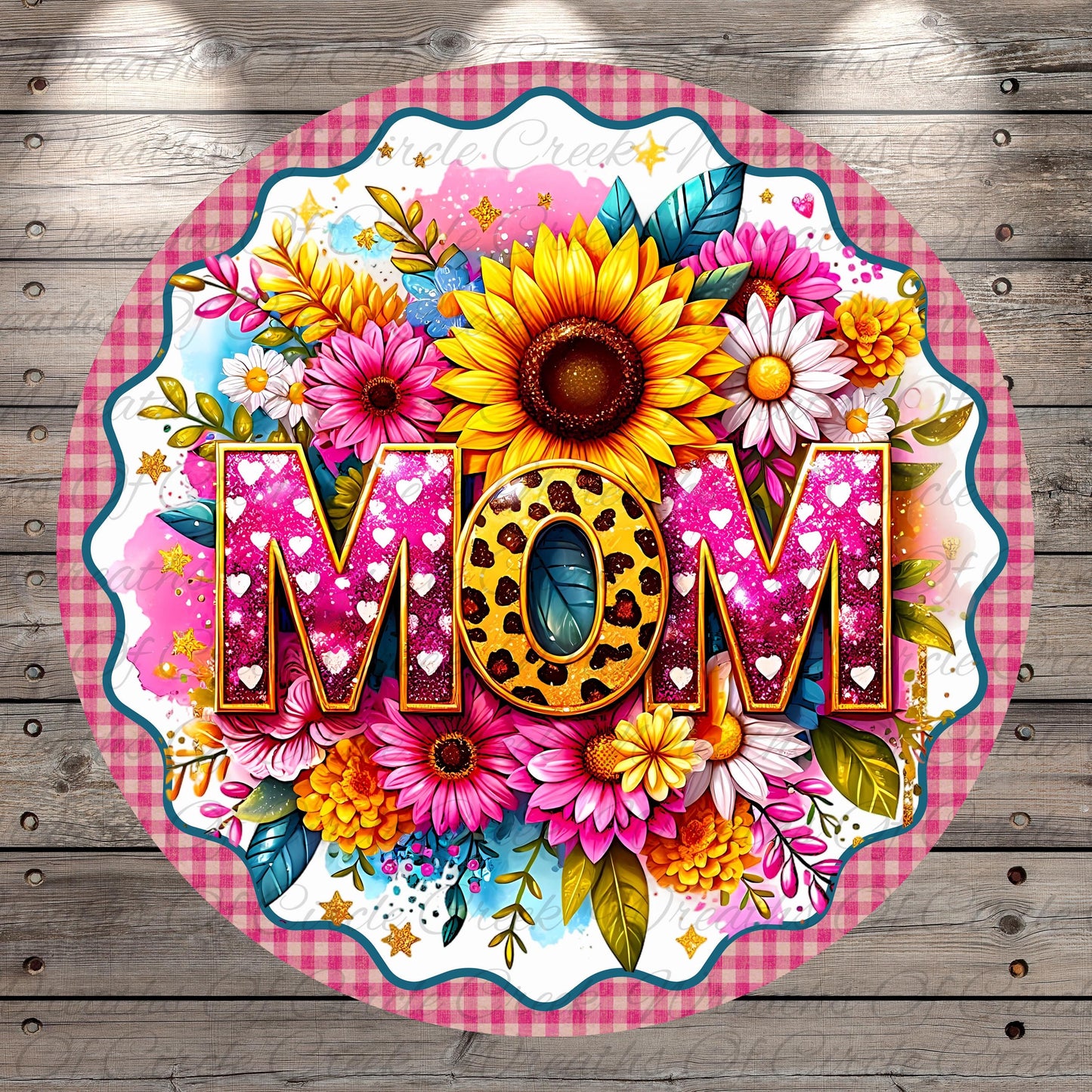 A round, decorative plate with a floral design and the word "MOM" prominently displayed in the center.