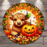 A whimsical illustration featuring a Highland cow with horns, a carved jack-o-lantern, and a colorful autumnal background with candy canes, leaves, and a sunburst pattern.