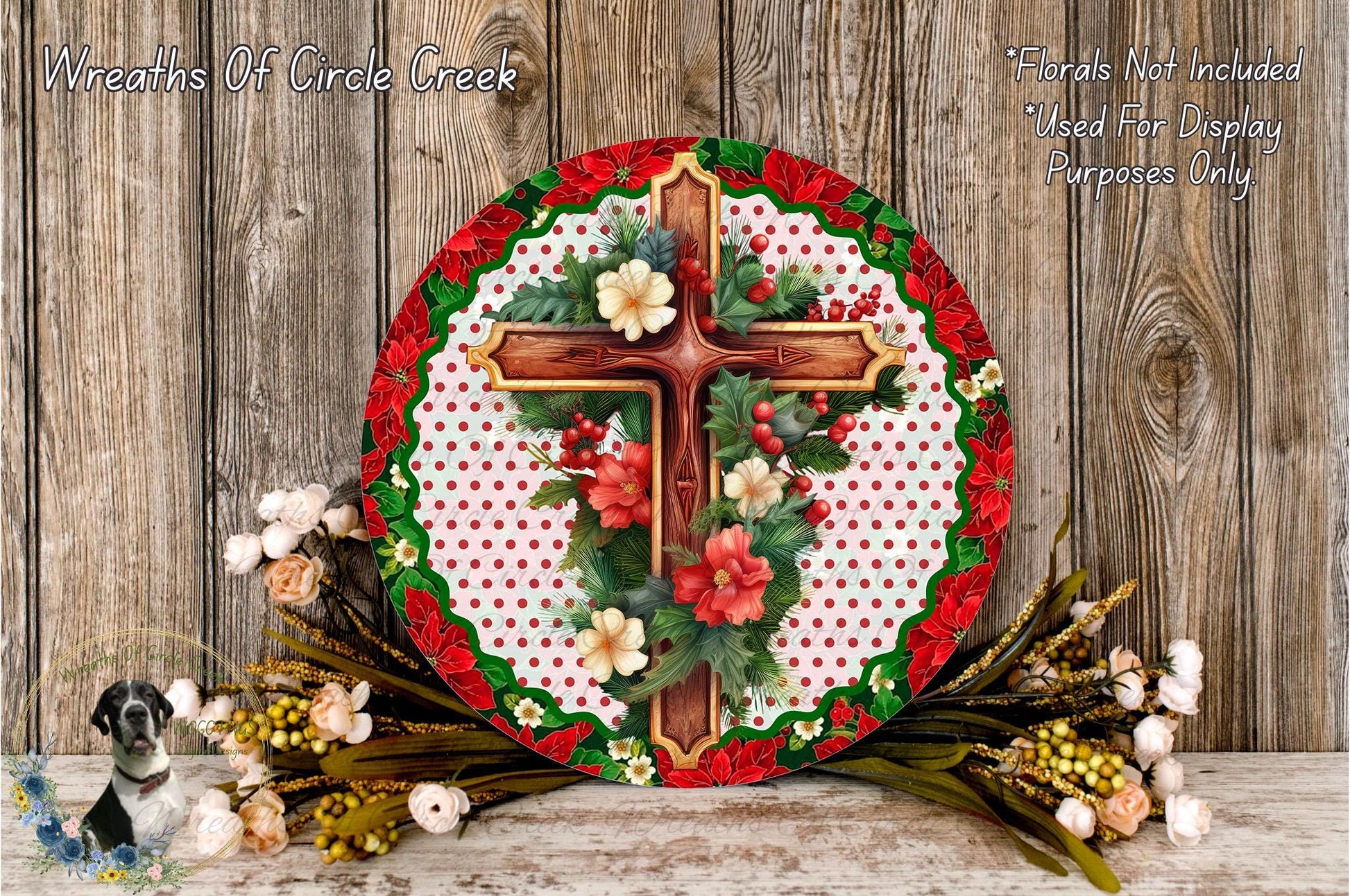a decorative wreath with a cross and floral elements, placed on a wooden surface.
