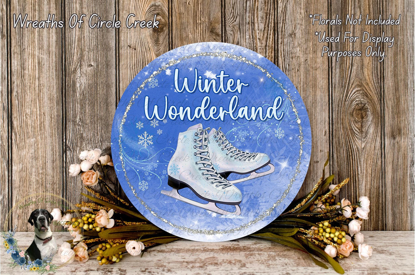 A round blue sign with the words "Winter Wonderland" and an illustration of ice skates, surrounded by flowers and a wooden background.