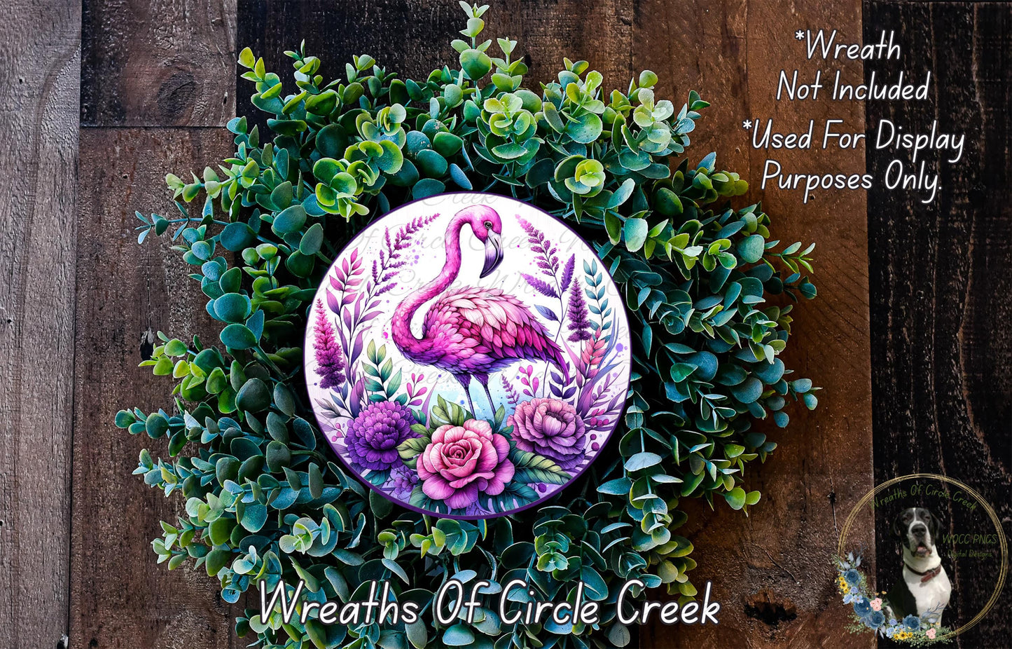 a wreath with a pink flamingo painted on it
