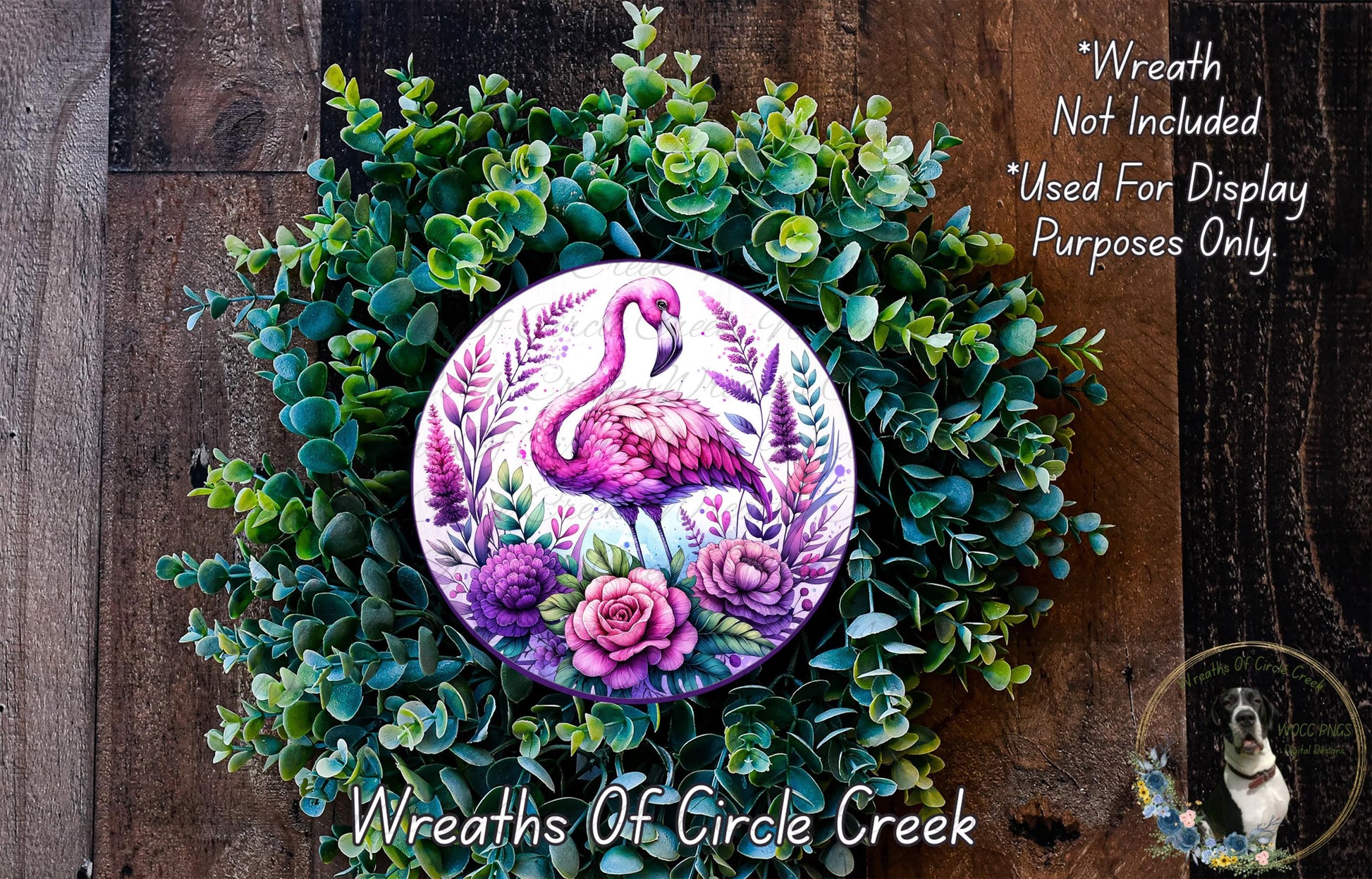 a wreath with a pink flamingo painted on it