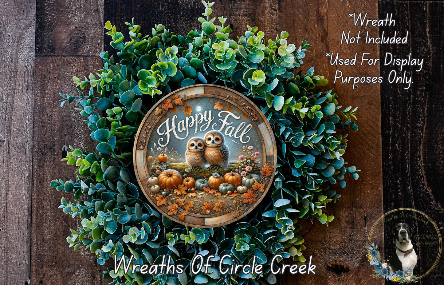 A wreath made of green leaves and pumpkins, with two owls sitting on top, and a circular plaque with the text "Happy Fall" and an illustration of pumpkins and gourds.