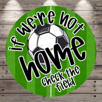 a soccer ball and a green background with the text "If we're not home, check the field" written on it.