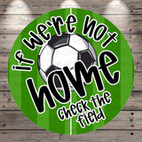 a soccer ball and a green background with the text "If we're not home, check the field" written on it.