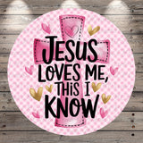 A pink and white checkered background with a large pink cross and the text "JESUS LOVES ME, THIS I KNOW" written on it.