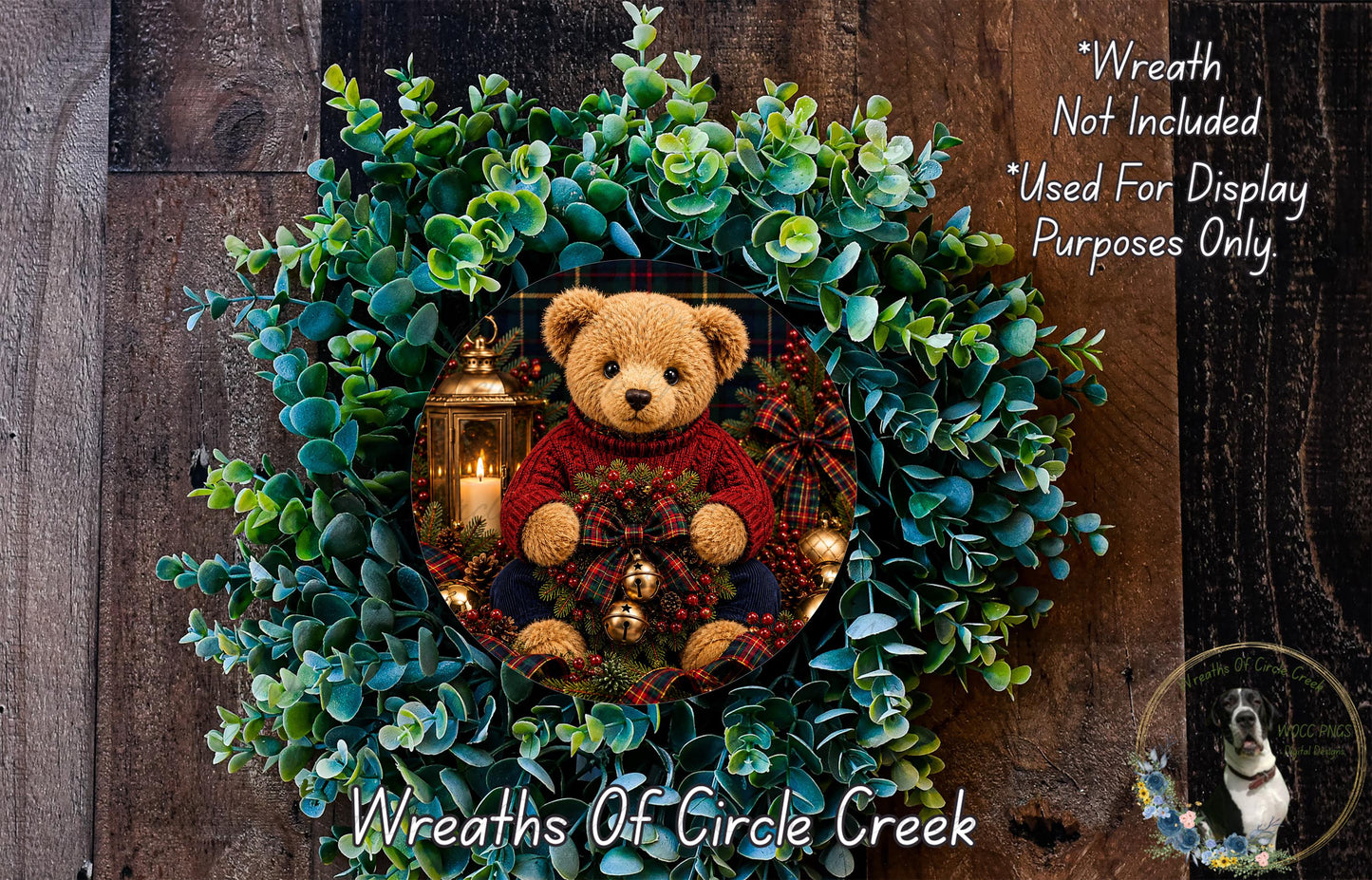 A wreath made of green leaves and a teddy bear, with a lantern and other holiday decorations, is displayed on a wooden wall.