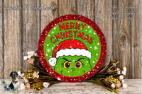 A festive Christmas wreath with a green Grinch wearing a Santa hat, surrounded by flowers and a wooden background.