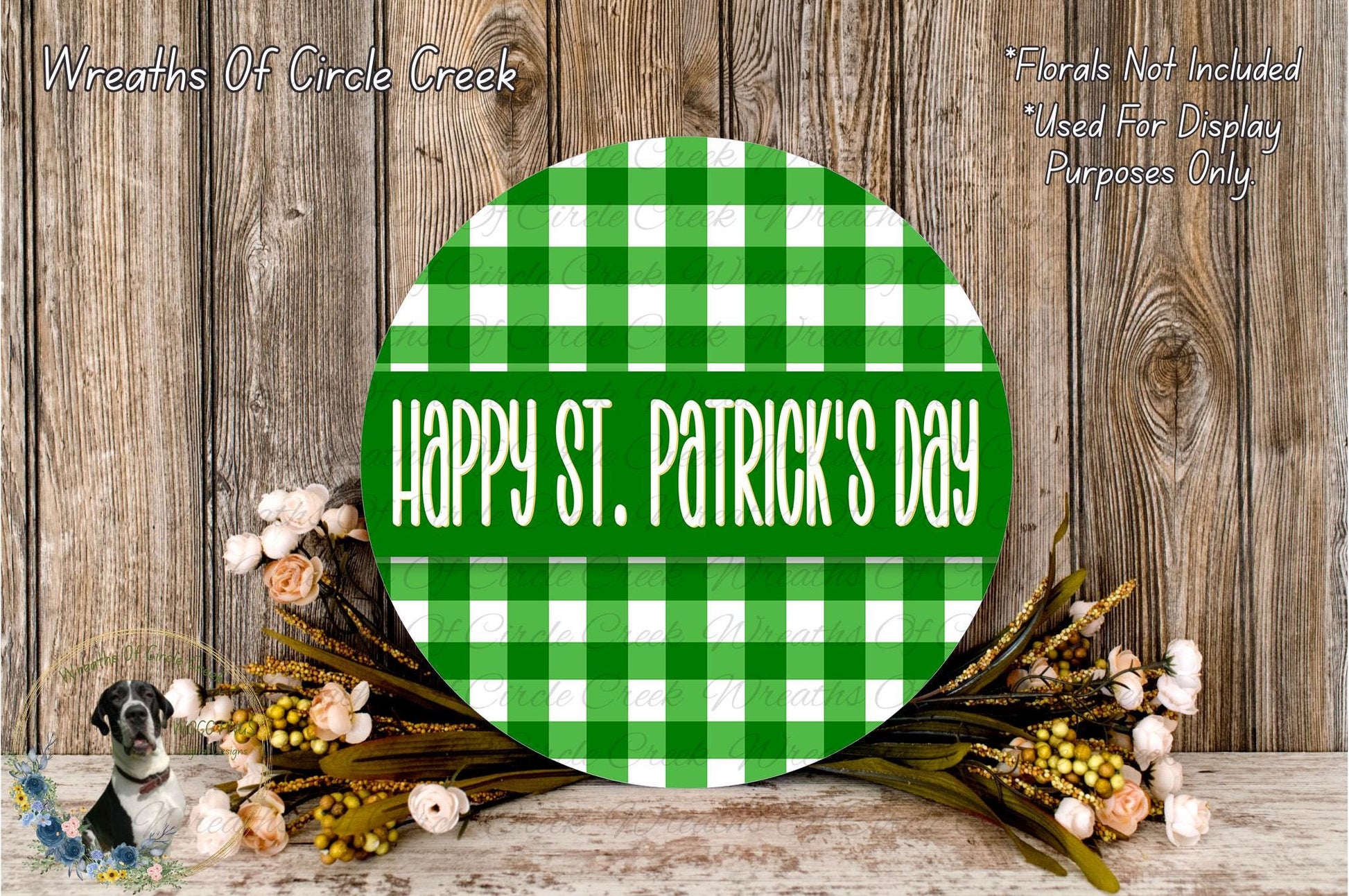 a circular green and white checkered sign with the text "Happy St. Patrick's Day" displayed on it, surrounded by a wreath of flowers and a wooden background.