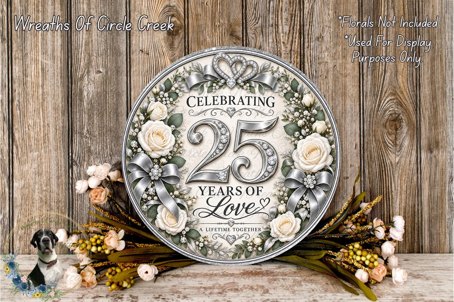 A decorative sign celebrating a 25th anniversary, surrounded by flowers and greenery, with a wooden background.