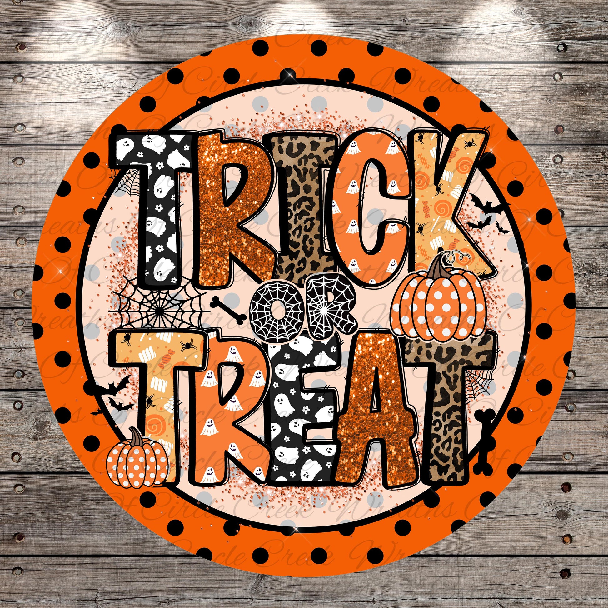 a circular design with the text "TRICK or TREAT" in a bold, orange font. Surrounding the text are various Halloween-themed elements, including a spider web, a leopard print, and two pumpkins. The design has a playful and festive appearance, with the use of orange, black, and white colors creating a visually appealing and eye-catching design.