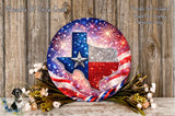 a decorative plate with a Texas state map design, surrounded by fireworks and flowers, placed on a wooden surface.