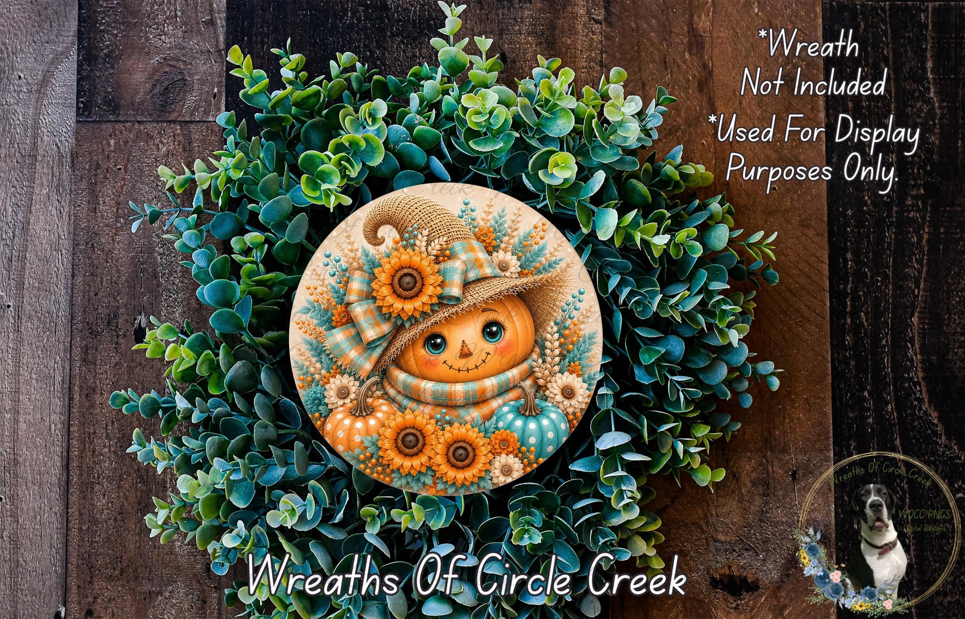 a wreath with a pumpkin face and flowers, surrounded by greenery.